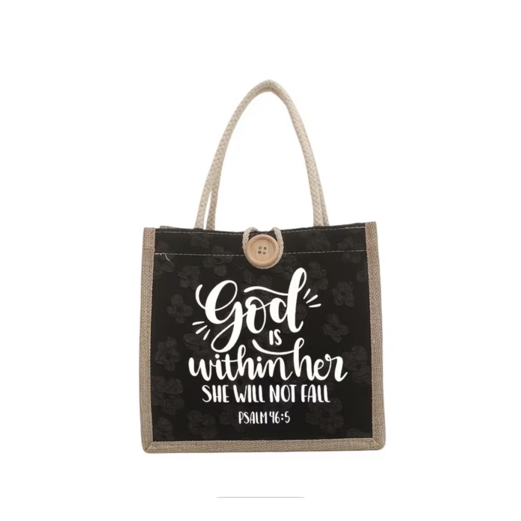 Black jute and canvas tote bag with a wooden button and the words God Is Within Her, She Will Not Fall, Psalm 46:5