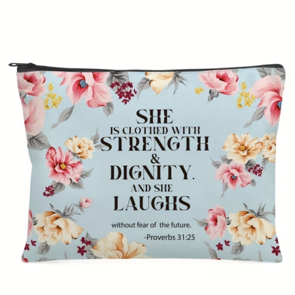 Floral zip pouch on a pale blue background printed with She Is Clothed With Strength And Dignity, Proverbs 31:25