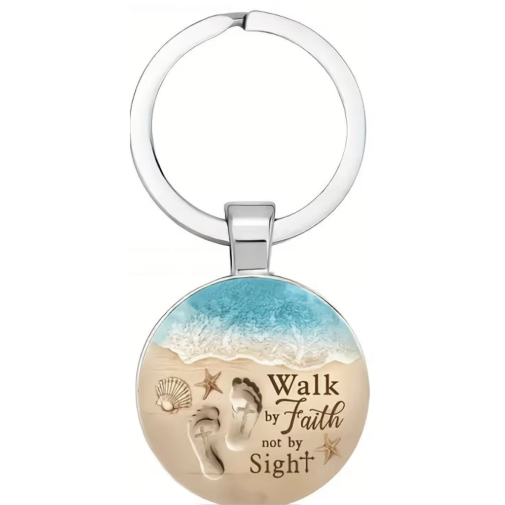 Walk By Faith Not By Sight glass keyring with a beach and footprints design under a domed glass cabochon