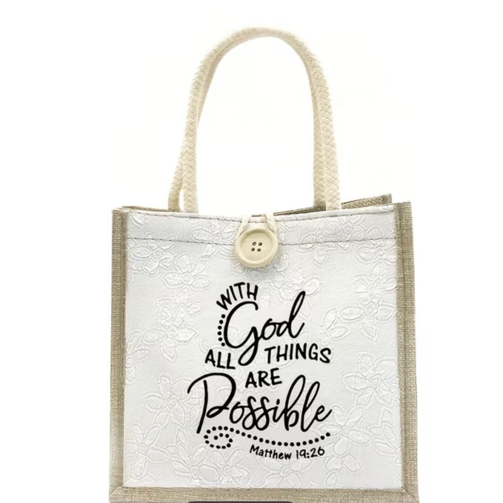 Cream jute and canvas tote bag with a wooden button and the words With God All Things Are Possible, Matthew 19:26